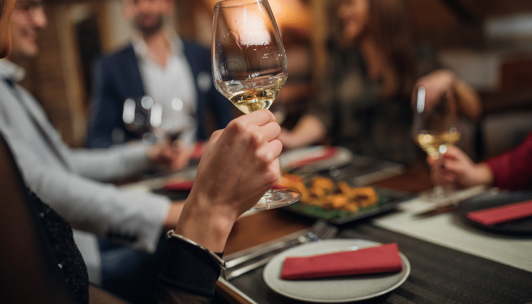 Image of wine glass and dinner